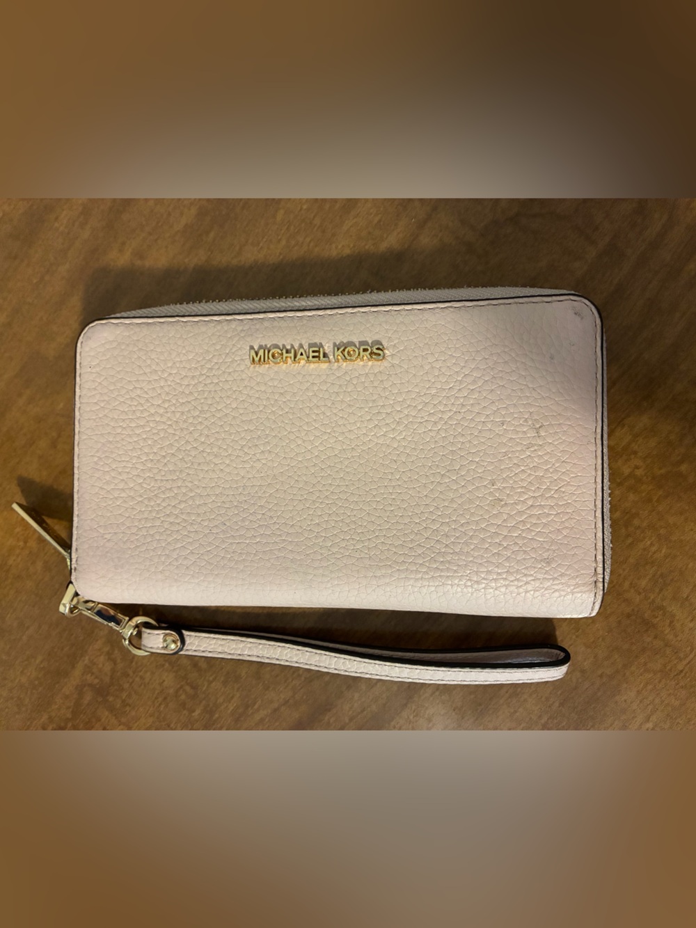 Michael Kors Pale Pink Pebbled
Leather Zip-Around Wallet with Gold Hardware